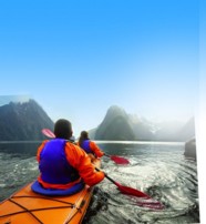  Kayaking towards Mitre Peak in Milford Sound New Zealand  