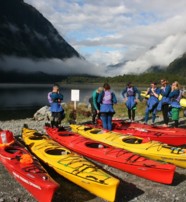  Guides holding a safety and kayaking briefing Fiordland New Zealand  